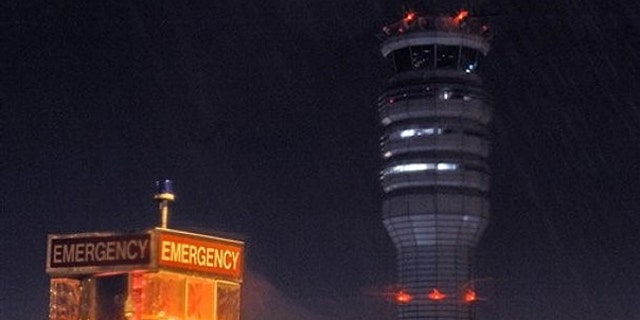 March 23: The FAA control tower at Reagan National Airport is seen during a storm, in Arlington, Va.