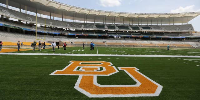 FILE - In this Aug. 18, 2014 file photo, media and visitors tour the nearly completed McLane Stadium during a tour at Baylor University in Waco, Texas. The $260 million stadium located near campus on the Brazos river debuts at the end of the month and replaces the 64-year-old Floyd Casey Stadium. (AP Photo/Waco Tribune Herald, Rod Aydelotte, File)