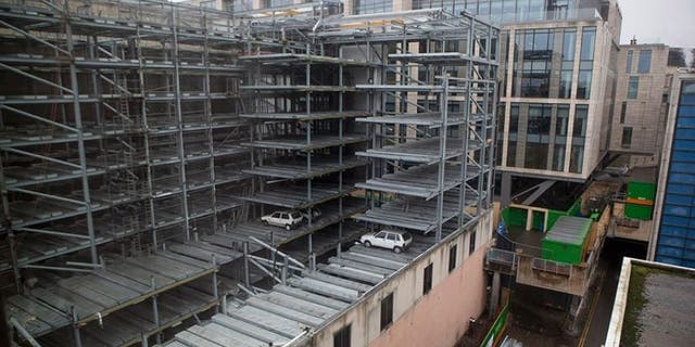 Onlookers in nearby buildings started posting images of the cars when the walls were removed in January.