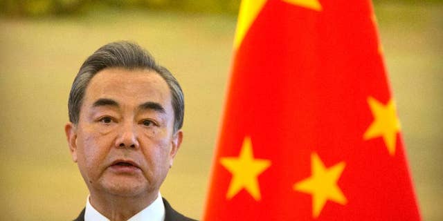 FILE - In this Thursday, April 13, 2017 file photo, Chinese Foreign Minister Wang Yi speaks during a joint press conference with the Palestinian Foreign Minister at the Ministry of Foreign Affairs in Beijing. Wang made a new appeal for calm on the Korean peninsula Tuesday, April 18, 2017, and said he believes the United States would prefer a diplomatic rather than military resolution to the standoff. (AP Photo/Mark Schiefelbein, File)