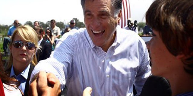 Republican presidential candidate, former Massachusetts Gov. Mitt Romney, greets supporters during a campaign stop in Portsmouth, Va., on Thursday, May 3, 2012. (AP Photo/Virginian-Pilot,Ross Taylor)