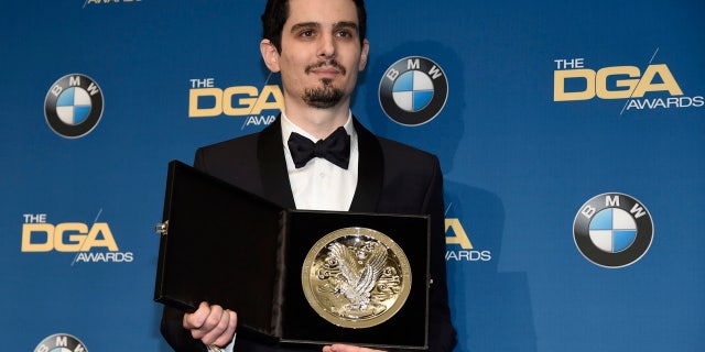 Damien Chazelle, director of "La La Land," holds his nominee's medallion backstage at the 69th annual Directors Guild of America Awards at the Beverly Hilton on Saturday, Feb. 4, 2017, in Beverly Hills, Calif.