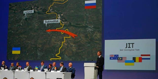 Wilbert Paulissen of the Joint Investigation Team (JIT) speaks on the preliminary results of the investigation into the shooting-down of Malaysia Airlines jetliner flight MH17 during a press conference in Nieuwegein, Netherlands, Wednesday, Sept. 28, 2016. The disaster claimed 298 lives. (AP Photo/Peter Dejong)