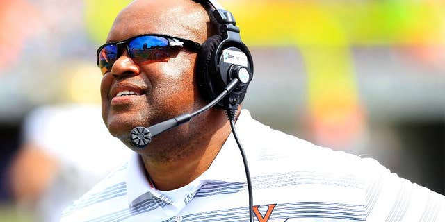 Virginia head coach Mike London up during the second half of an NCAA college football game against UCLA at Scott Stadium, Saturday, Aug. 30, 2014, in Charlottesville, Va. UCLA won 28-20. (AP Photo/Andrew Shurtleff)