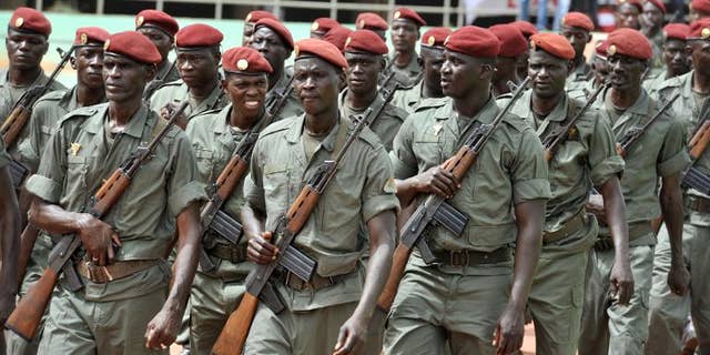 Army forces march during the inauguration of Mali's new president on September 19, 2013 in Bamako