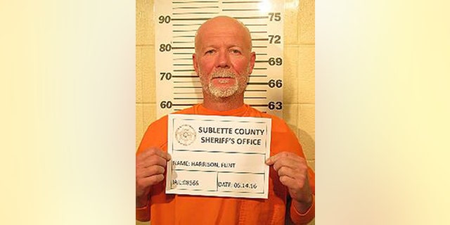 This May 14, 2016, photo provided by the Sublette County Sheriff's Office shows Flint Wayne Harrison. Officers culminated a manhunt late Saturday night with the arrest of Dereck James "DJ" Harrison, 22, several hours after the surrender of his father, Flint Wayne Harrison, 51, the Sublette County Sheriff's Office said. A woman and her four teenage daughters who were lured to a Utah house and tied up in the basement were thrilled and relieved to learn the father and son charged in the bizarre attack were in custody in Wyoming, authorities said Sunday. (Sublette County Sheriff's Office via AP) MANDATORY CREDIT