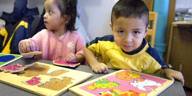Young students learning in a classroom (Photo by Tim Boyle/Getty Images)