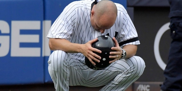 Yankees third base coach Joe Espada reacts after a young girl was hit by a foul ball on Wednesday at Yankee Stadium.