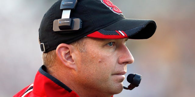 North Carolina State head coach Dave Doeren watches from the sideline in the fourth quarter of an NCAA college football game against Boston College in Boston, Saturday, Nov. 16, 2013. Boston College won 38-21. (AP Photo/Michael Dwyer)