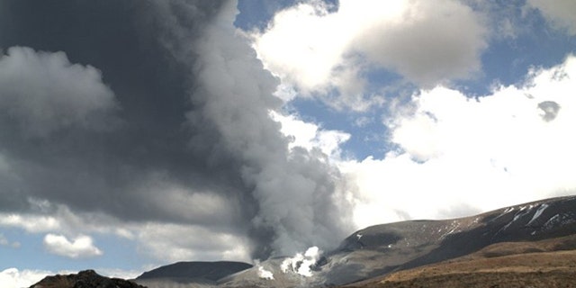 In this photo released by the Institute of Geological and Nuclear Sciences, smoke is shown billowing out of Te Maari crater on Mount Tongariro, New Zealand after a brief eruption Wednesday, Nov. 21, 2012.