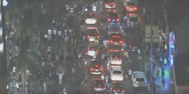 Hundreds of people mourning the rapper took over a central Los Angeles neighborhood.