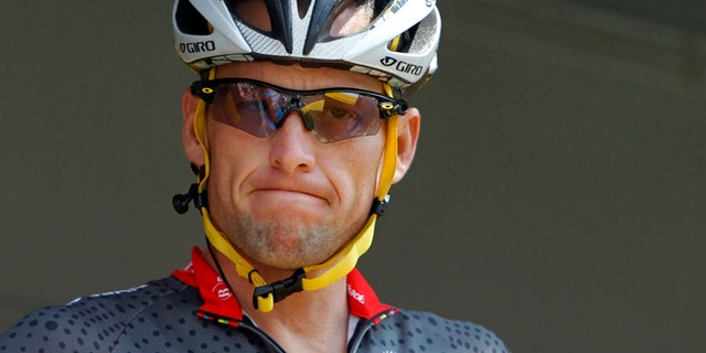 July 6, 2010: Lance Armstrong grimaces prior to the start of the third stage of the Tour de France cycling race in Wanze, Belgium.