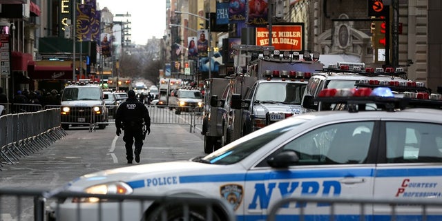 New York Police Department (NYPD) officers secure Times Square ahead of New Year's Eve celebrations, Dec. 31, 2017.