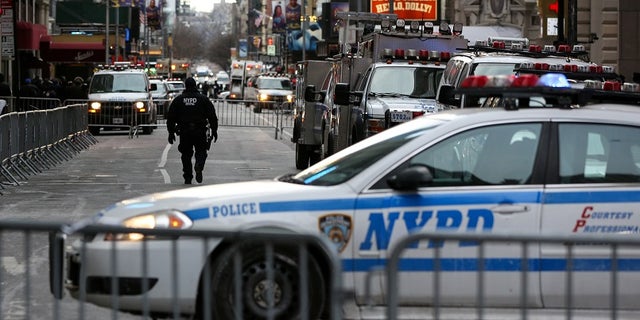New York Police Department (NYPD) officers secure Times Square ahead of New Year's Eve celebrations, Dec. 31, 2017.