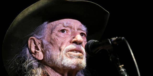 Willie Nelson took gifted face masks and turned them into a charitable endeavor. 