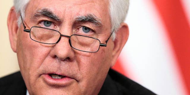 FILE- In this April 12, 2017, file photo, Secretary of State Rex Tillerson speaks to the media during a news conference with Russian Foreign Minister Sergey Lavrov in Moscow. The “America First” president who vowed to extricate America from onerous overseas commitments appears to be warming up to the view that when it comes to global agreements, a deal’s a deal. The administration says it is reviewing these accords and could still pull out of them. A day after certifying Iran’s compliance with the nuclear deal, Tillerson attacked the accord and listed examples of Iran’s bad behavior. His tone suggested that even if Iran is fulfilling the letter of its nuclear commitments, the deal remains on unsure footing.(AP Photo/Ivan Sekretarev, File)