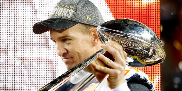 Denver Broncos' quarterback Peyton Manning holds the Vince Lombardi Trophy after the Broncos defeated the Carolina Panthers in the NFL's Super Bowl 50 football game in Santa Clara, California February 7, 2016. REUTERS/Mike Blake - RTX25WVJ
