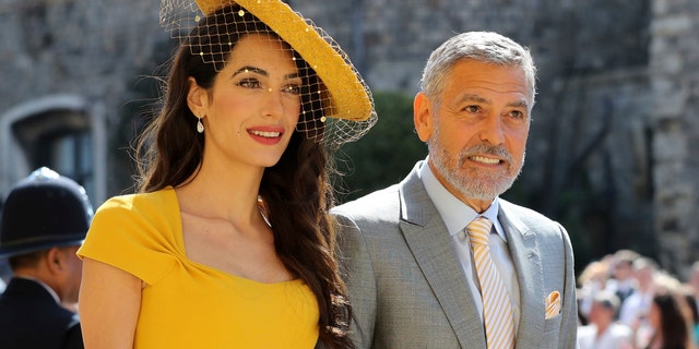 Amal Clooney and George Clooney have been fending off rumors they are expecting another child. The A-list pair is seen pictured at the wedding ceremony of Prince Harry and Meghan Markle.