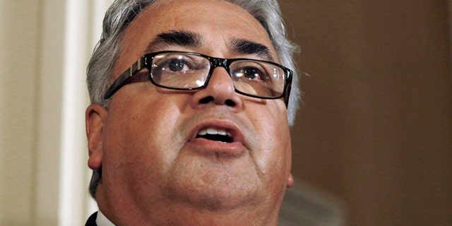 FILE - In this June 10, 2013, file photo, State Sen. Ron Calderon, D-Montebello, left, holds a news conference at the Capitol in Sacramento, Calif. Calderon and his brother, Tom Calderon were indicted by a federal grand jury on multiple political corruption charges, including mail and wire fraud, bribery and money laundering, the U.S. Attorney's Office announced Friday Feb. 21, 2014.(AP Photo/Rich Pedroncelli, File)