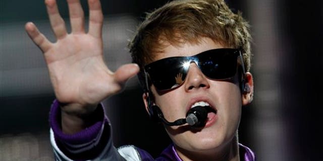 Pop sensation Justin Bieber performs during his "My World Tour" concert at Foro Sol in Mexico City, Saturday Oct. 1, 2011. (AP Photo/Marco Ugarte)