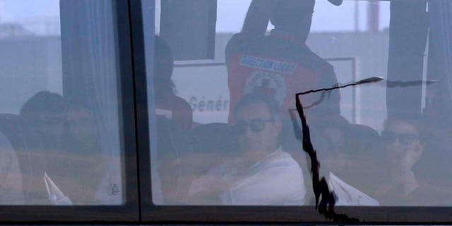 Relatives of victims in a bus after their arrival at Marseille airport, southern France, Thursday March 26, 2015.