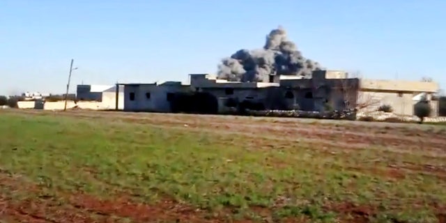 In this image taken from video obtained from the Shaam News Network, which has been authenticated based on its contents and other AP reporting, smoke rises due to heavy shelling in Taftanaz, Idlib province, northern Syria, on Thursday, Jan. 10, 2013. (AP Photo/Shaam News Network via AP video)