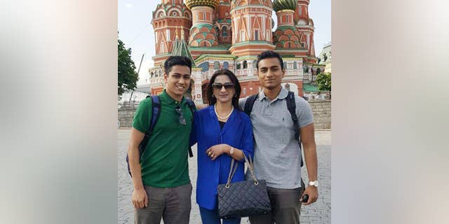 This May 26, 2016, photo, provided by the Hossain Family shows Faraaz Hossain, left, mother, Simeen, center, and brother, Zaraif, right, in Moscow, Russia. When Faraaz Hossain’s family received his body after the deadly siege at the Holey Artisan Bakery in Dhaka, Bangladesh, on July 2, 2016, they noticed the palm of his right hand had been sliced clean through. The wound suggested the 20-year-old Faraaz, the family’s beloved youngest child, had grabbed the attacker’s sword and tried to fight back. (Hossain Family photo via AP)