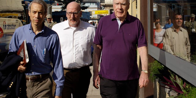 U.S. Sen. Patrick Leahy, right, arrives to the Hotel Parque Central along with two unidentified men in Havana, Cuba.