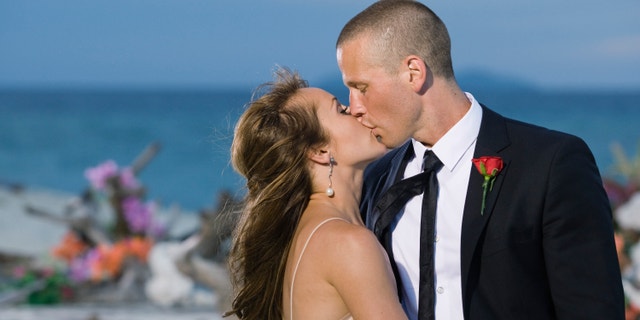 Ashley Hebert, left, kisses J.P. Rosenbaum on the season finale of "The Bachelorette" in Fiji.