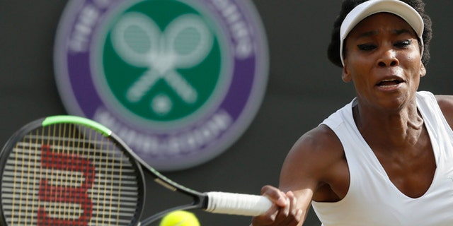 Venus Williams of the United States returns to Japan's Naomi Osaka during their Women's Singles Match on day five at the Wimbledon Tennis Championships in London Friday, July 7, 2017. (AP Photo/Kirsty Wigglesworth)