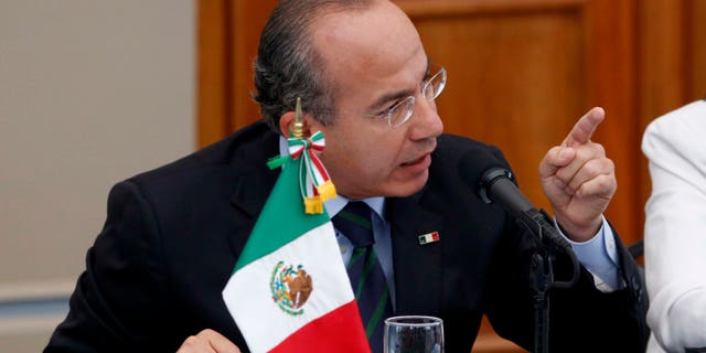 Mexico's President Felipe Calderon, gestures during a meeting with victims of violence in Mexico City, Thursday June 23, 2011. Calderon says he doesn't regret his strategy to fight organized crime, despite calls to end a confrontation that has killed at least 35,000 during his administration. (AP Photo/Eduardo Verdugo)