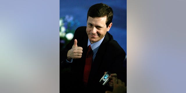 FILE - In this Jan. 18, 2006 file photograph, Israeli Isaac Herzog, a former cabinet minister, gestures after the primary results were announced during a convention in the community of Beit Berl in central Israel. Veteran lawmaker Herzog has unseated the incumbent Labor Party leader Shelly Yachimovich on Friday, Nov. 22, 2013, and will become Israel’s new opposition leader. (AP Photo/Ariel Schalit, File)