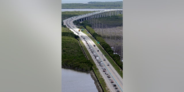 Motorists head north on US 1, Wednesday, Sept. 6, 2017, in Key Largo, Fla., in anticipation of Hurricane Irma.