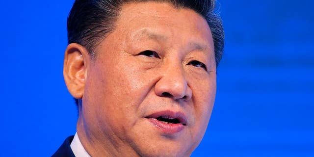 FILE - In this Jan. 17, 2017, file photo, Chinese President Xi Jinping speaks at the World Economic Forum in Davos, Switzerland. U.S. President Donald Trump has reaffirmed America’s long-standing “one China” policy in a telephone conversation with Xi that could alleviate concerns about a major shift in Washington’s approach to relations with Beijing. The long-awaited call came Thursday, Feb. 9, 2017, Washington time, the White House and China’s state broadcaster CCTV said. (AP Photo/Michel Euler, File)