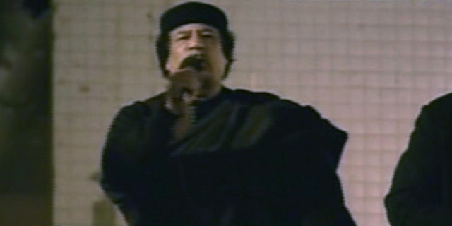 March 22: This image taken from Libyan State TV shows Libyan leader Muammar al-Qaddafi as he talks to a large crowd in Bab El Azizia, Libya.