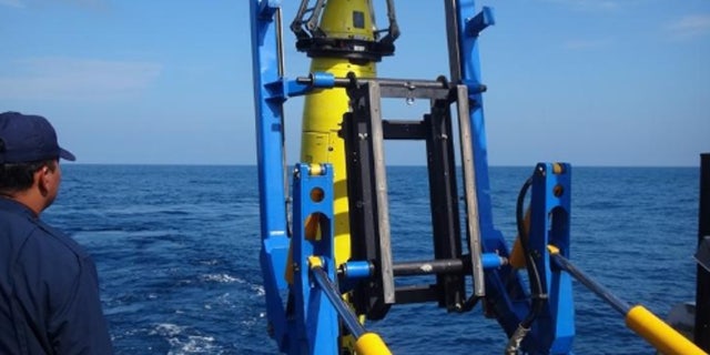 REMUS 6000 being deployed off the Colombian Navy research ship ARC Malpelo.
