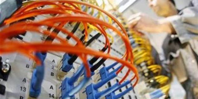 A worker prepares a server in a file photo.