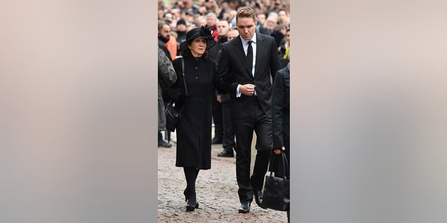 Stephen Hawking’s first wife, Jane, and their son Timothy, attend the famed physicist’s funeral.