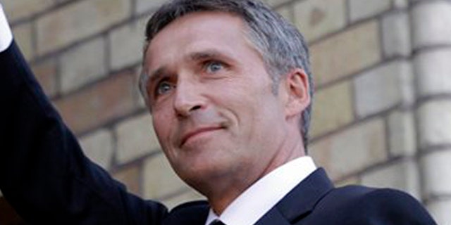 Norway's Prime Minister Jens Stoltenberg waves to supporters as he arrives for a memorial to honor the victims of the July 22 bombing and shooting massacre, at the parliament in Oslo, Monday, Aug. 1, 2011.