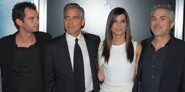 Jonas Cuaron, George Clooney, Sandra Bullock and Alfonso Cuaron attend the "Gravity" premiere on October 1, 2013 in New York City.