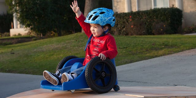 Crue Allred's wheelchair tends to get stuck, and the plucky toddler's mom is seeking a more mobile model. (Family photo)