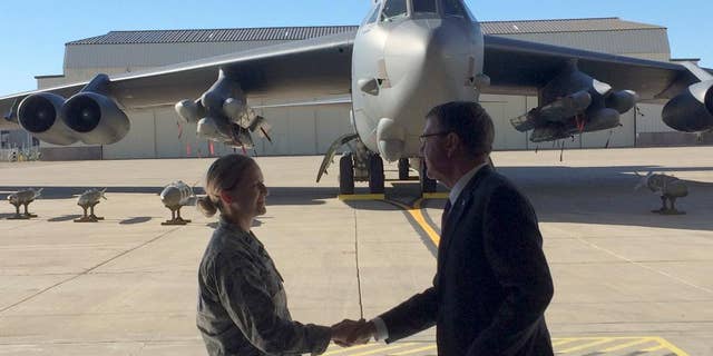 Defense Secretary Ash Carter greets airmen at Minot Air Force Base, N.D., Monday, Sept. 26, 2016, after giving a speech on nuclear weapons. Carter says the Pentagon is committed to correcting what he calls decades of shortchanging its nuclear forces. Carter spoke Monday at a nuclear missile and bomber base in Minot. He says $108 billion is earmarked for sustaining and improving the forces over the next five years. (AP Photo/Robert Burns)