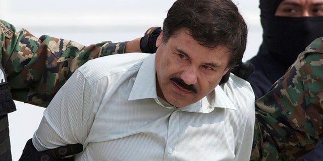 Joaquin "El Chapo" Guzman escorted to a helicopter in Mexico City on Feb. 22, 2014.