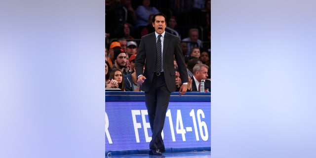Miami Heat coach Erik Spoelstra calls to his team during the first half of an NBA basketball game against the New York Knicks on Saturday, Feb. 1, 2014, in New York. Miami won 106-91. (AP Photo/Jason DeCrow)