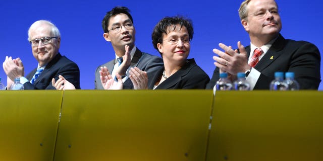 From left: Free Democratic Party (FDP) faction leader Rainer Bruederle. German economy minister, vice-chancellor and party chairman, Philipp Roesler, vice-chairwoman of the party, Birgit Homburger and development minister Dirk Niebel attend a meeting of the FDP in Stuttgart, southern Germany, Sunday, Jan. 6, 2013. Germany's embattled vice chancellor is battling to quell speculation about his leadership of the country's junior governing party, whose dire poll ratings are a complicating factor in Chancellor Angela Merkel's bid for re-election. Philipp Roesler, who's also Germany's economy minister, appealed to his pro-market Free Democratic Party on Sunday to show unity ahead of a state election in his home region of Lower Saxony on Jan. 20, an important political test ahead of national elections in September. (AP Photo/dpa/ Bernd Weißbrod)