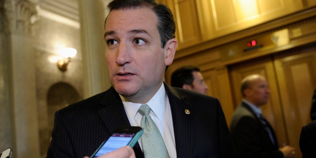 Oct. 9, 2013: Sen. Ted Cruz talks with reporters following a vote on Capitol Hill in Washington.