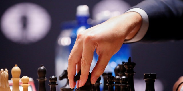 FILE - Sergei Karjakin of Russia makes a move during a match with Magnus Carlsen of Norway during the fifth round of the 2016 World Chess Championship in New York, November. September 17, 2016 (REUTERS/Shannon Stapleton)