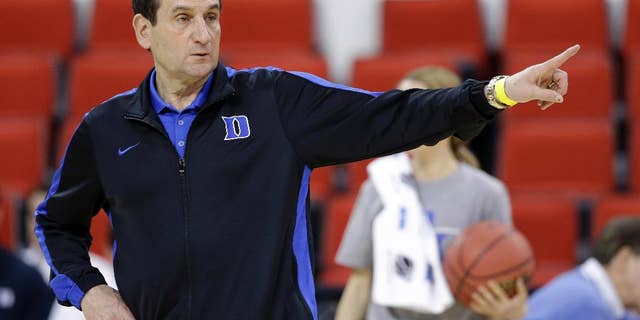 March 20, 2014: Duke head coach Mike Krzyzewski directs his team during practice at the NCAA college basketball tournament in Raleigh, N.C.