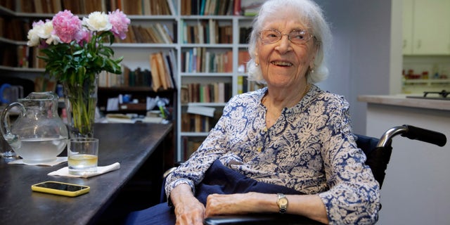 In this Friday, May 29, 2015 photo, artist Carmen Herrera is interviewed in her New York studio. Herrera, who turned 100 on Sunday, May 31, says she's still bursting with ideas she wants to put on canvas. (AP Photo/Richard Drew)