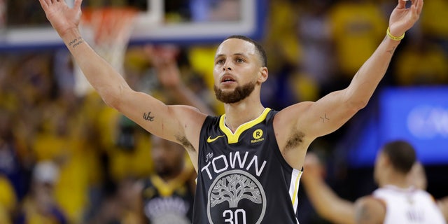 June 3: Golden State Warriors guard Stephen Curry (30) celebrates during the second half of Game 2.
